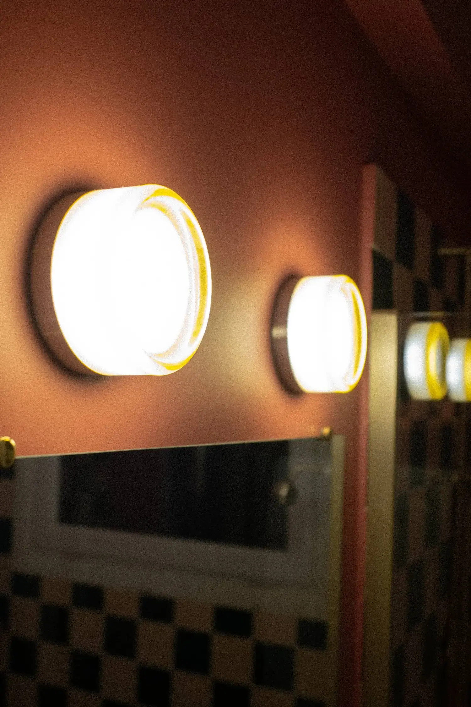 Flagey — wall lights on a coral wall