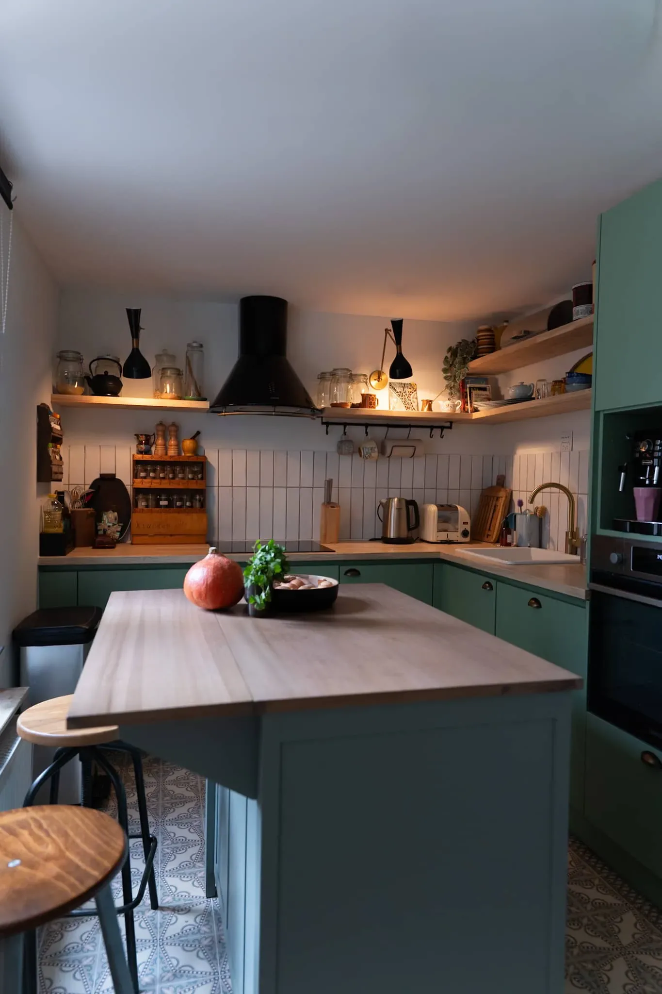 Schaerbeek — sage-green kitchen with central island